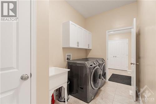 Full Laundry Room & Upgraded Mud Room from Garage - 379 Andalusian Crescent, Kanata (9010 - Kanata - Emerald Meadows/Trailwest), ON - Indoor Photo Showing Laundry Room