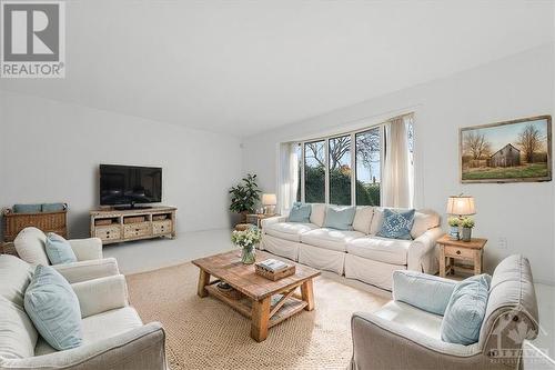 This photo has been virtually staged. - 1763 Calumet Lane, Orleans - Convent Glen And Area (2006 - Convent Glen South), ON - Indoor Photo Showing Living Room