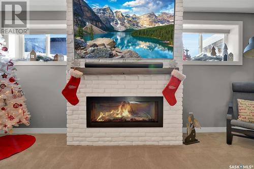 4828 Mccombie Crescent, Regina, SK - Indoor Photo Showing Living Room With Fireplace