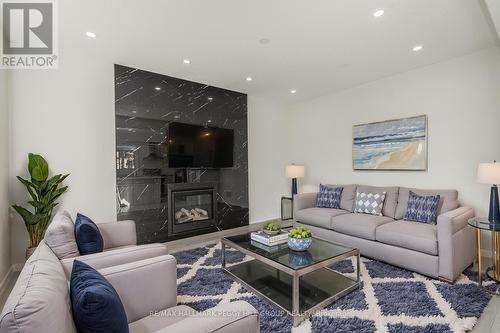 28 Sanford Circle, Springwater, ON - Indoor Photo Showing Living Room With Fireplace