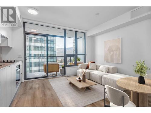 This photo has been virtually staged. - 1488 Bertram Street Unit# 1101, Kelowna, BC - Indoor Photo Showing Living Room