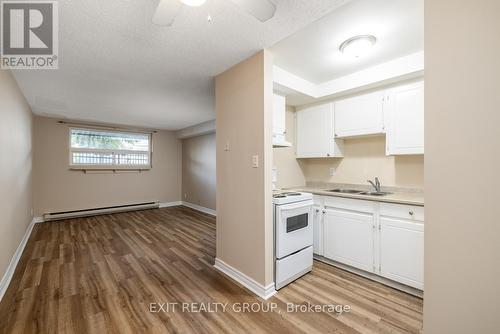 103 - 25 College Street E, Belleville, ON - Indoor Photo Showing Kitchen With Double Sink