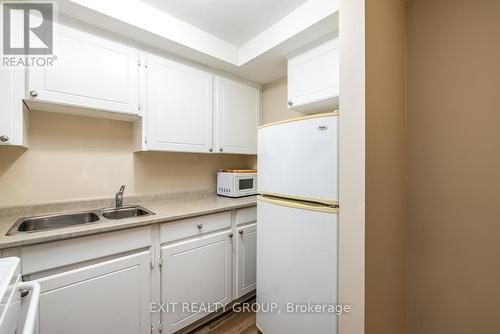 103 - 25 College Street E, Belleville, ON - Indoor Photo Showing Kitchen With Double Sink