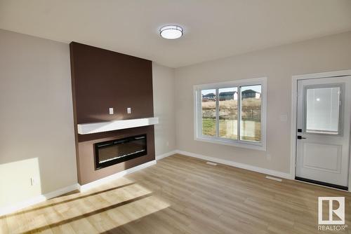 #Upper 8835 Carson Wy Sw, Edmonton, AB - Indoor Photo Showing Living Room With Fireplace