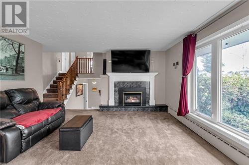 219 Pescod Avenue, Cornwall, ON - Indoor Photo Showing Living Room With Fireplace