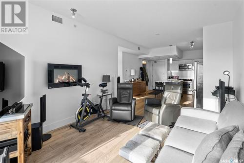 306 404 C Avenue S, Saskatoon, SK - Indoor Photo Showing Living Room With Fireplace