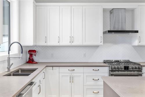 1888 Northern Flicker Court, Kelowna, BC - Indoor Photo Showing Kitchen With Double Sink