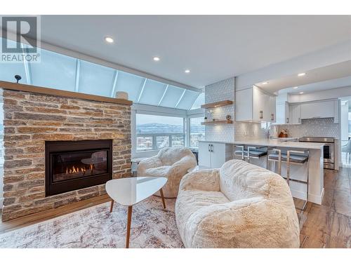 1160 Sunset Drive Unit# 1702, Kelowna, BC - Indoor Photo Showing Living Room With Fireplace