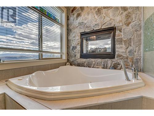 Main House Ensuite - 645 St Annes Road, Spallumcheen, BC - Indoor Photo Showing Bathroom With Fireplace