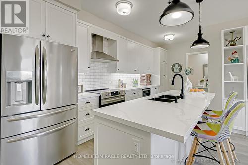 408 - 58 Adam Sellers Street, Markham, ON - Indoor Photo Showing Kitchen With Stainless Steel Kitchen With Double Sink With Upgraded Kitchen