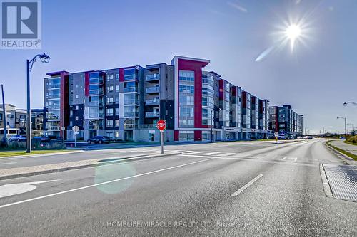 408 - 58 Adam Sellers Street, Markham, ON - Outdoor With Facade