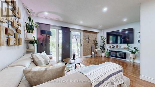 7 - 431 Military Trail, Toronto, ON - Indoor Photo Showing Living Room With Fireplace