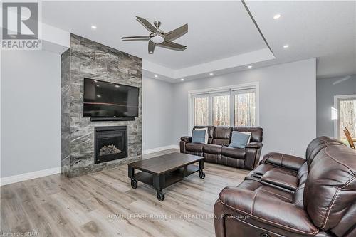 129 Ruth Anne Place, Mapleton, ON - Indoor Photo Showing Living Room With Fireplace