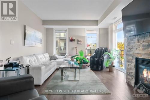 3 - 80 Prestige Circle, Ottawa, ON - Indoor Photo Showing Living Room With Fireplace