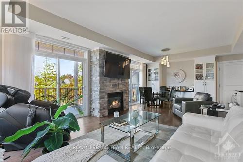 3 - 80 Prestige Circle, Ottawa, ON - Indoor Photo Showing Living Room With Fireplace