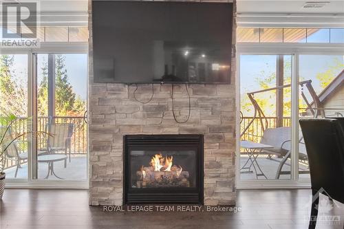 3 - 80 Prestige Circle, Ottawa, ON - Indoor Photo Showing Living Room With Fireplace