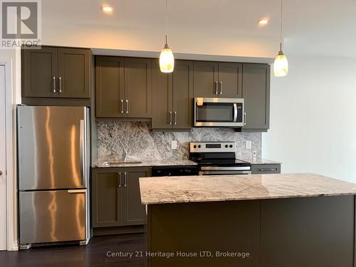 716 - 7711 Green Vista Gate, Niagara Falls (220 - Oldfield), ON - Indoor Photo Showing Kitchen With Upgraded Kitchen