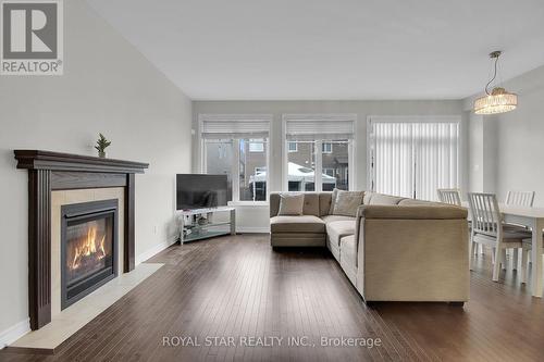 88 Eric Maloney Way, Ottawa, ON - Indoor Photo Showing Living Room With Fireplace