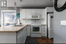 6822 Madrid Way Unit# 310, Kelowna, BC  - Indoor Photo Showing Kitchen With Double Sink 