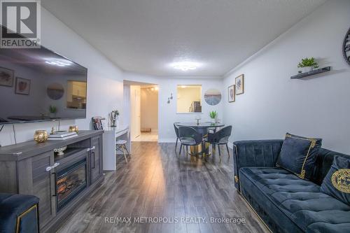 801 - 430 Mclevin Avenue, Toronto, ON - Indoor Photo Showing Living Room With Fireplace