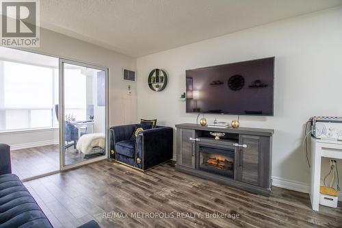 801 - 430 Mclevin Avenue, Toronto, ON - Indoor Photo Showing Living Room With Fireplace