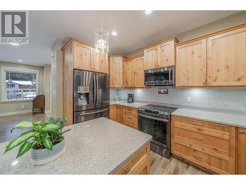 4889 Canium Court, 108 Mile Ranch, BC - Indoor Photo Showing Kitchen With Stainless Steel Kitchen