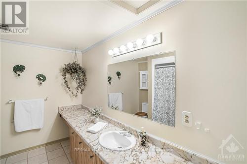 MAIN BATHROOM has a newer tub & shower, toilet, sink, and loads of storage. - 840 Cahill Drive W Unit#20, Ottawa, ON - Indoor Photo Showing Bathroom