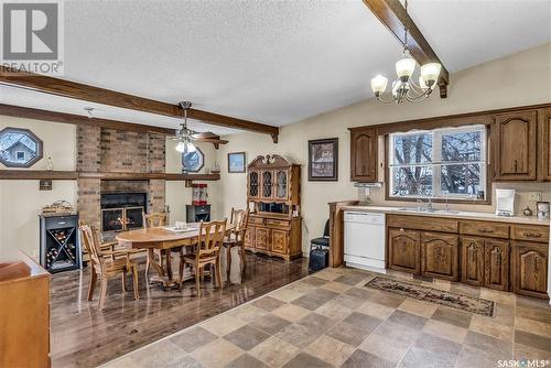 6103 Parsons Bay, Regina, SK - Indoor Photo Showing Dining Room With Fireplace