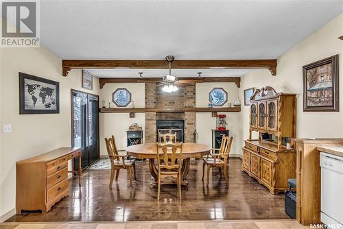 6103 Parsons Bay, Regina, SK - Indoor Photo Showing Dining Room With Fireplace