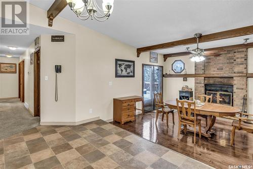 6103 Parsons Bay, Regina, SK - Indoor Photo Showing Dining Room With Fireplace