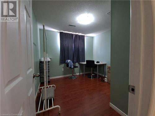 Office space featuring wood-type flooring and a textured ceiling - 12 Peer Drive Unit# Basement, Guelph, ON - Indoor