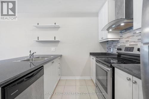 4 - 25 Heron Park Place, Toronto, ON - Indoor Photo Showing Kitchen With Double Sink