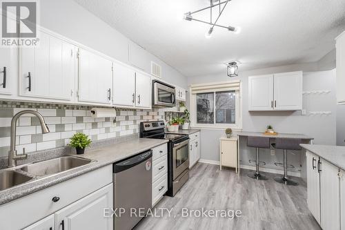 35 - 120 Ling Road, Toronto, ON - Indoor Photo Showing Kitchen With Double Sink