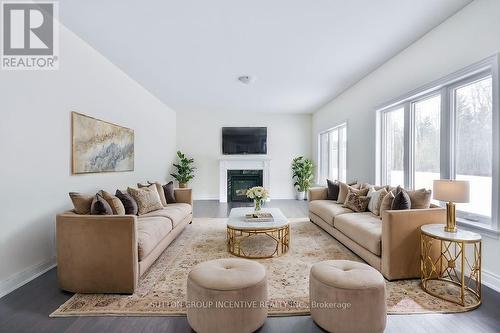 24 Cottonwood Street, Springwater, ON - Indoor Photo Showing Living Room With Fireplace