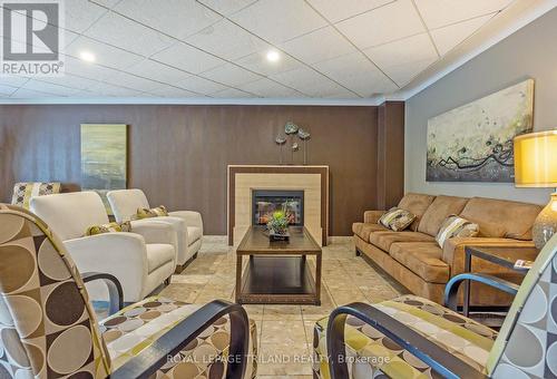 303 - 500 Talbot Street, London, ON - Indoor Photo Showing Living Room With Fireplace