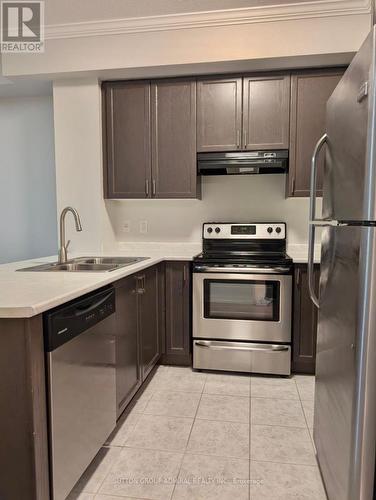 104 - 5317 Upper Middle Road, Burlington, ON - Indoor Photo Showing Kitchen With Stainless Steel Kitchen With Double Sink