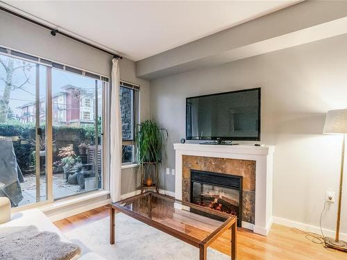 111-297 Hirst Ave West, Parksville, BC - Indoor Photo Showing Living Room With Fireplace