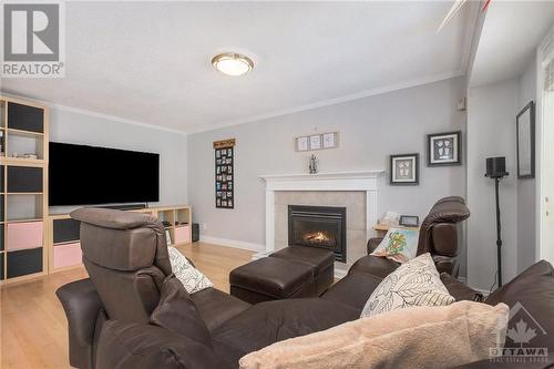 573 Apollo Way, Orleans, ON - Indoor Photo Showing Living Room With Fireplace