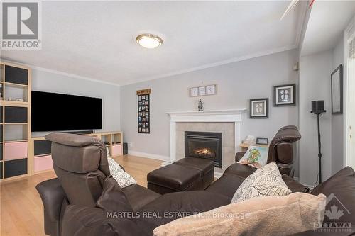 573 Apollo Way, Ottawa, ON - Indoor Photo Showing Living Room With Fireplace