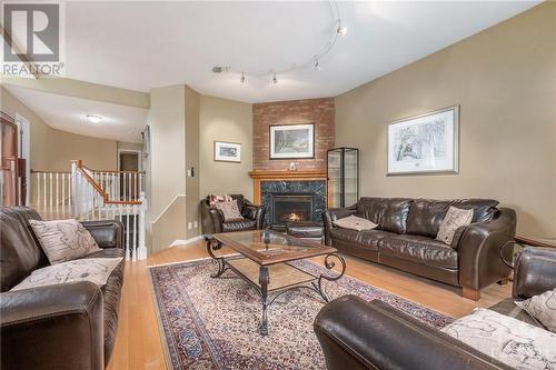 573 Apollo Way, Orleans, ON - Indoor Photo Showing Living Room With Fireplace