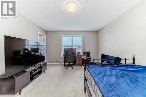 703, 10 Auburn Bay Avenue Se, Calgary, AB - Indoor Photo Showing Bedroom