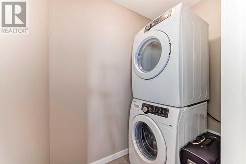 703, 10 Auburn Bay Avenue Se, Calgary, AB - Indoor Photo Showing Laundry Room