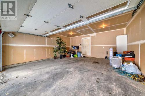 703, 10 Auburn Bay Avenue Se, Calgary, AB - Indoor Photo Showing Garage