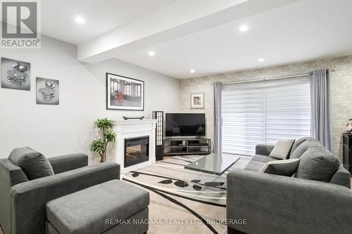 104 - 77 Linwell Road, St. Catharines (443 - Lakeport), ON - Indoor Photo Showing Living Room With Fireplace