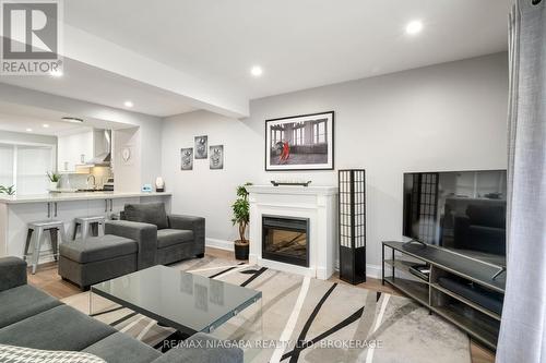 104 - 77 Linwell Road, St. Catharines (443 - Lakeport), ON - Indoor Photo Showing Living Room With Fireplace