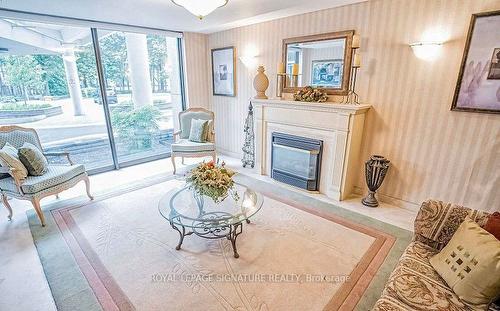 2007-3700 Kaneff Cres, Mississauga, ON - Indoor Photo Showing Living Room With Fireplace