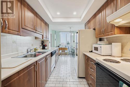 411 - 360 Watson Street W, Whitby (Port Whitby), ON - Indoor Photo Showing Kitchen With Double Sink