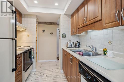 411 - 360 Watson Street W, Whitby (Port Whitby), ON - Indoor Photo Showing Kitchen With Double Sink