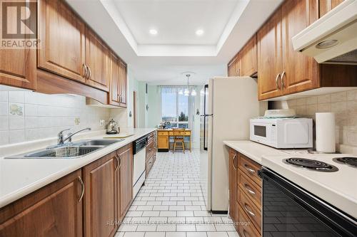 411 - 360 Watson Street W, Whitby (Port Whitby), ON - Indoor Photo Showing Kitchen With Double Sink