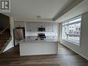 109 - 1593 Rose Way, Milton, ON  - Indoor Photo Showing Kitchen With Stainless Steel Kitchen With Double Sink 